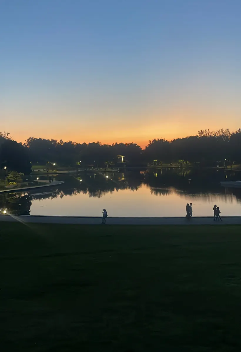 Beaver Lake at dusk, silhouettes strolling the water's edge